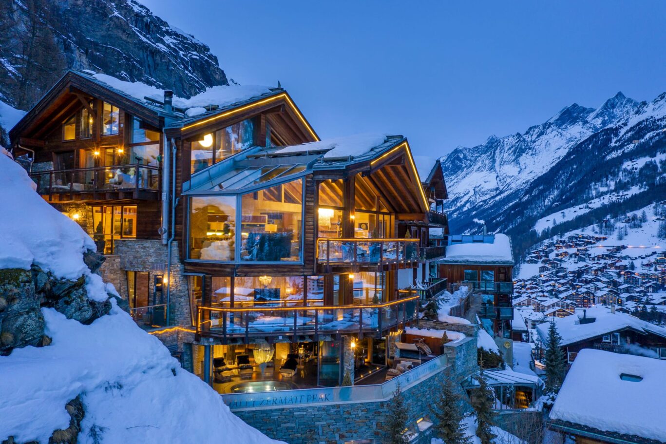 Chalet evening lit up looking towards tasch