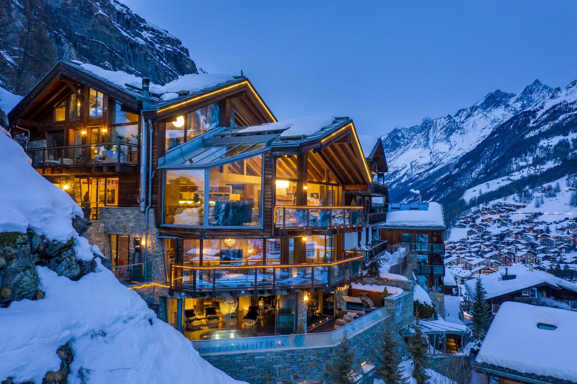 Chalet evening lit up looking towards tasch