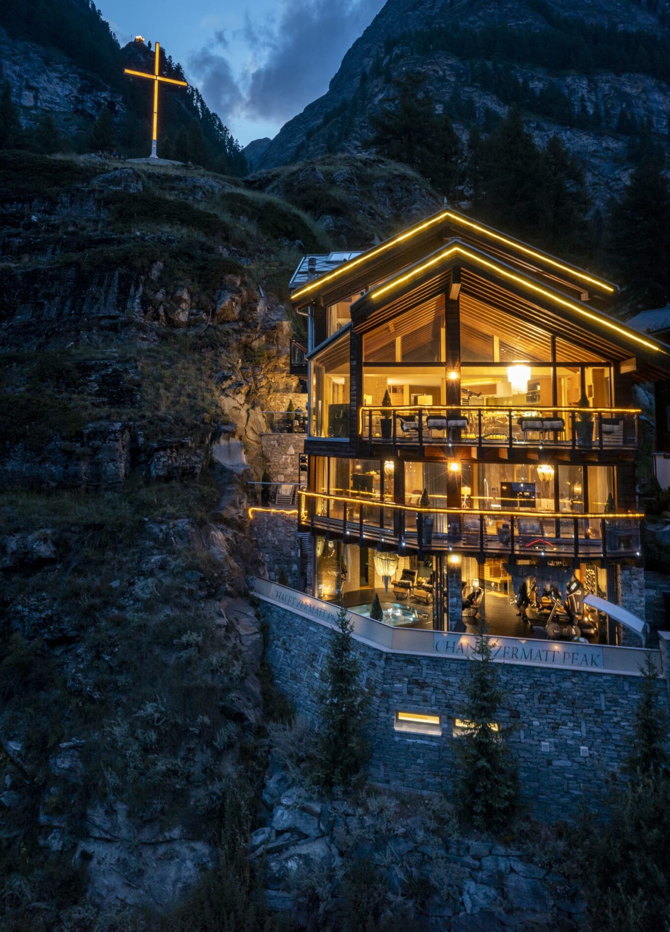 a. Chalet Portrait shot of Chalet lit up in evening Summer