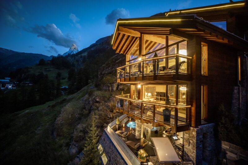 a. Chalet Summer Twighlight lit up whole chalet Light on horn