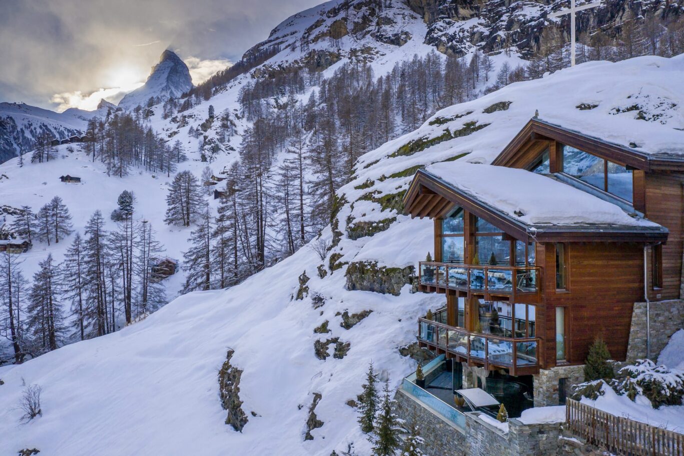 evening chalet hon in background sun about to go behind